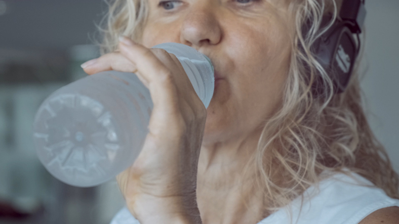 Woman drinking from a bottle of water